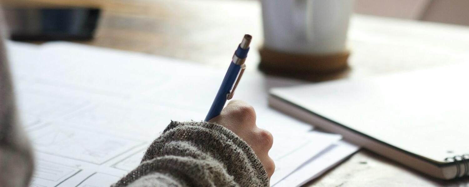 someone writing in document