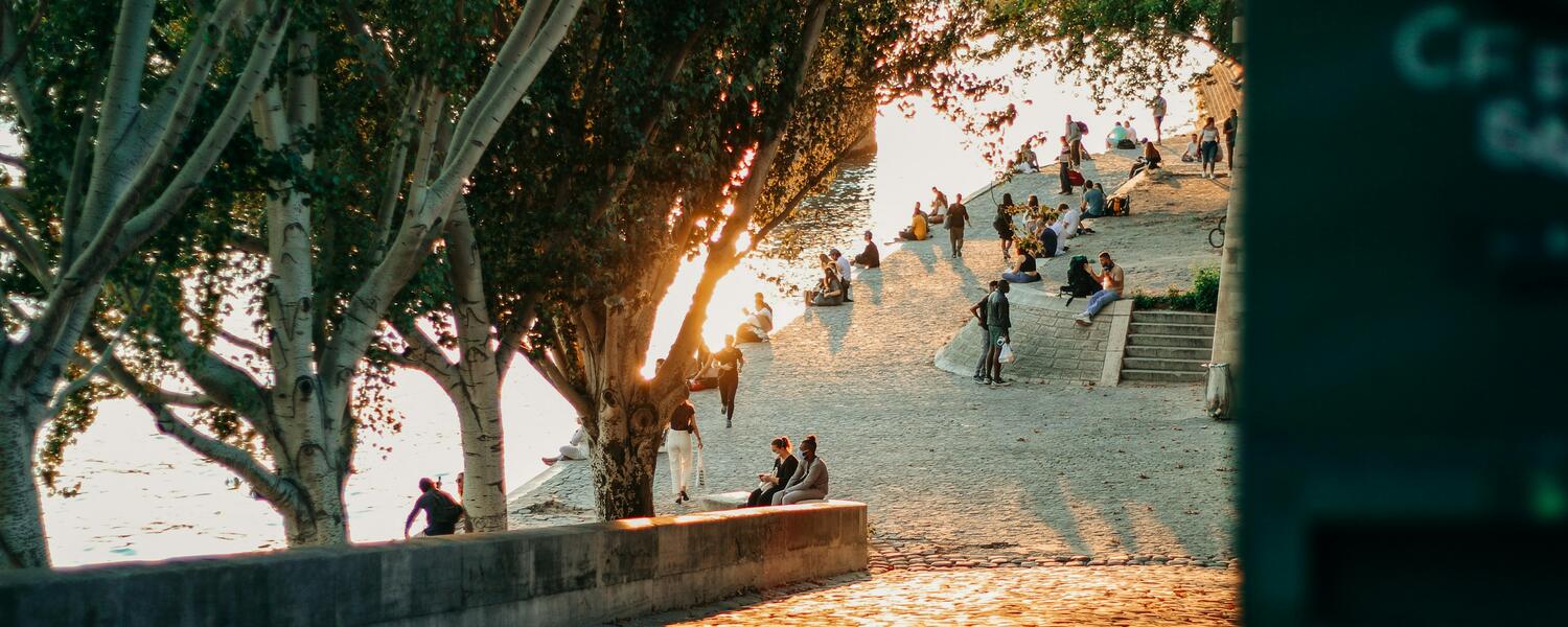 people sitting around water front