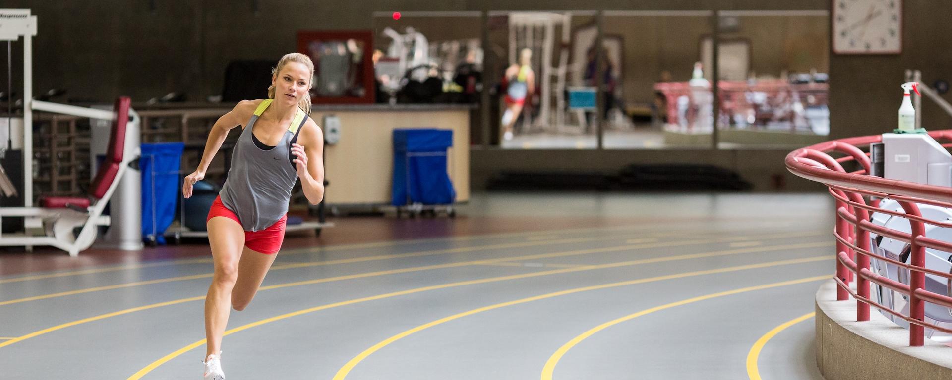 Woman running on the track in Kinesiology