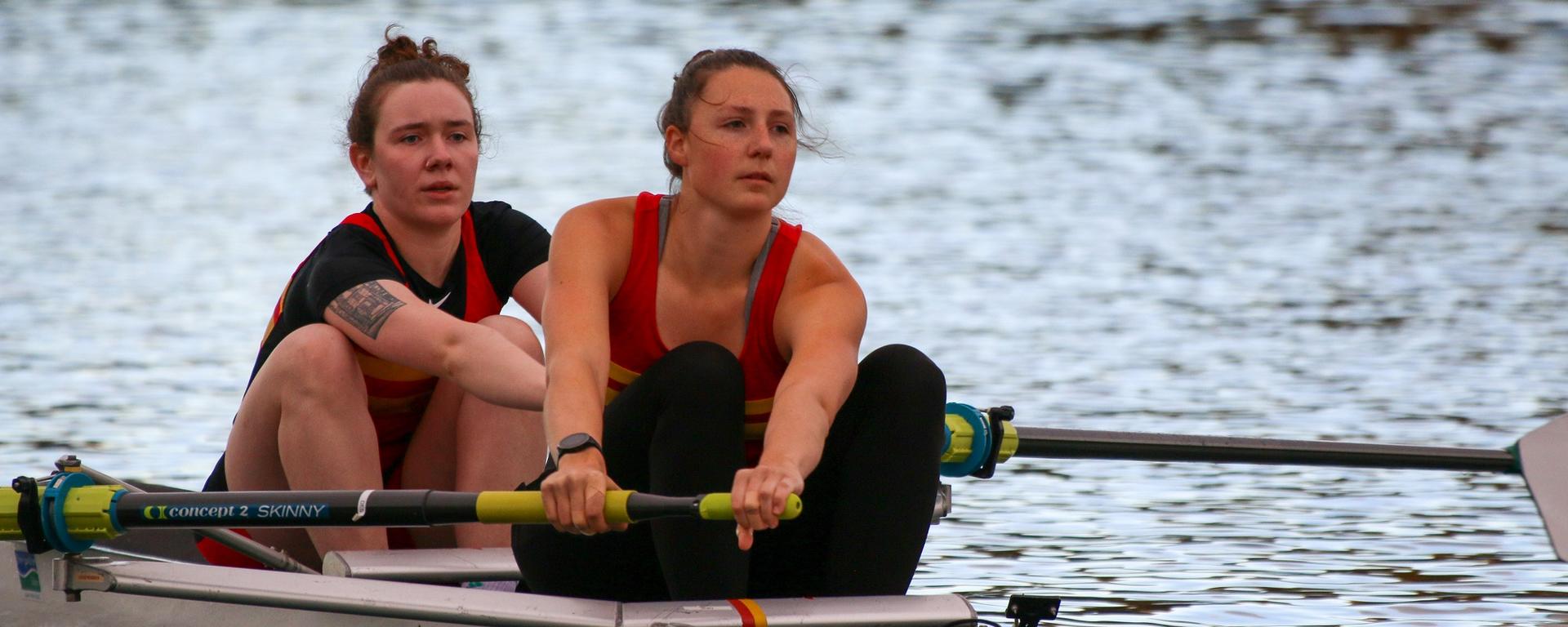 Claire O'Brien [left] and Eliza Dawson [right] row for UCalgary at the first Dino's Sprints Regatta race since COVID restrictions were lifted in September 2021