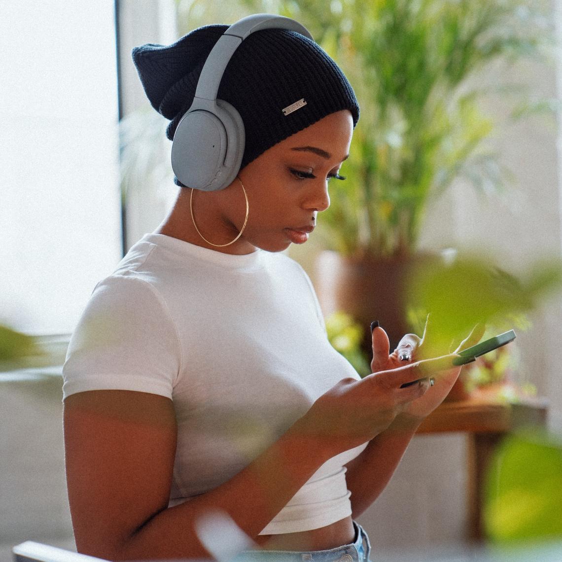 Woman looking at phone to do health app study 