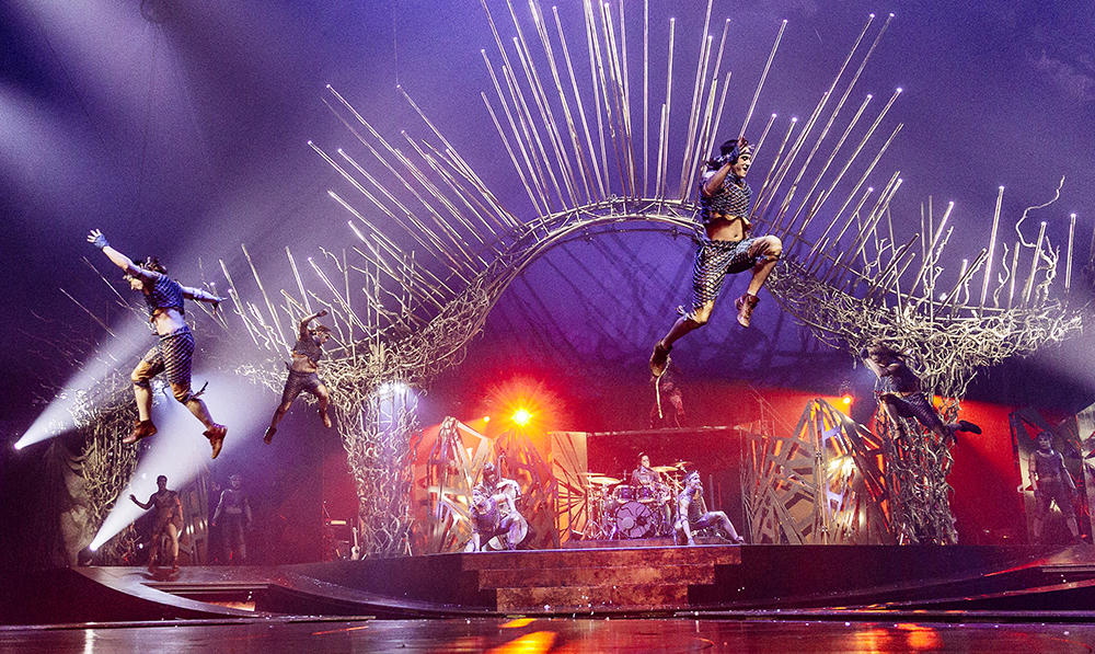 Alexander Seifert performing a jump in Cirque Du Soleil show
