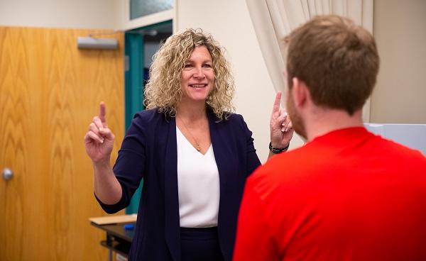 Dr. Kathryn Schneider testing client in the concussion lab