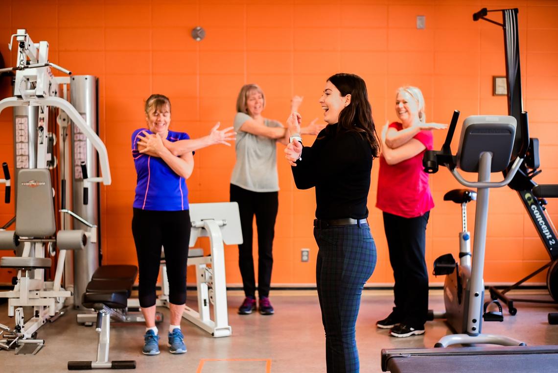Participants exercising with their instructor in the Thrive Centre