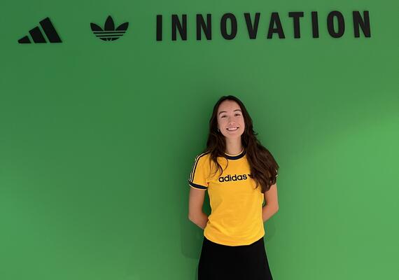 Emily Dittmer, Kinesiology undergraduate student stands in front of the adidas headquarters in Germany 