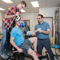 Professor in the lab with students 