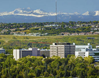 View of Calgary with mountains, city and campus