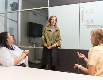 Dr. Cari Din with two students 